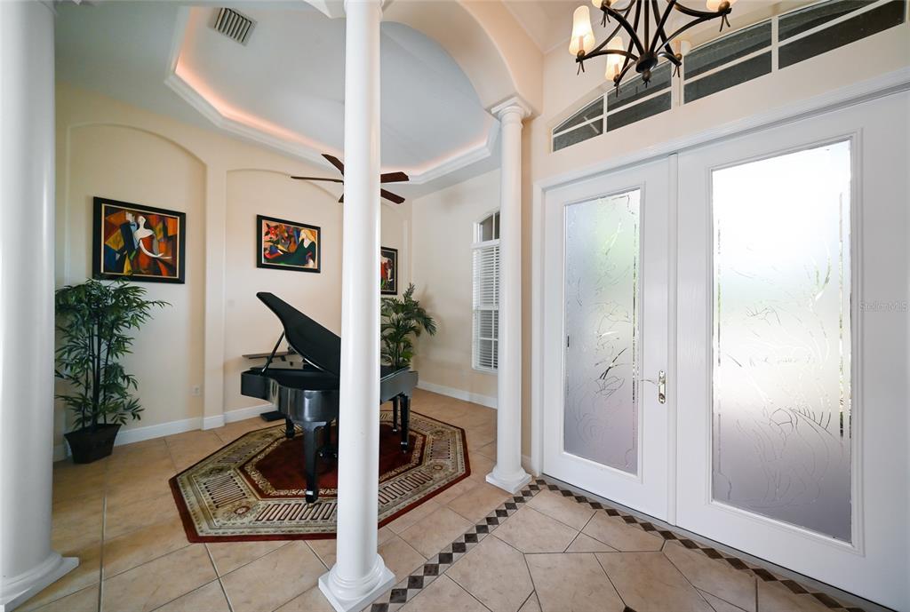 14806 Bowfin Terrace Lakewood Ranch, FL 34202 - Photo 13 of 58 a view of a livingroom with furniture and floor to ceiling window