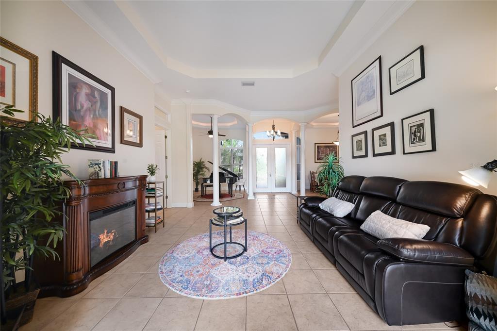14806 Bowfin Terrace Lakewood Ranch, FL 34202 - Photo 16 of 58 a living room with furniture and a dining table
