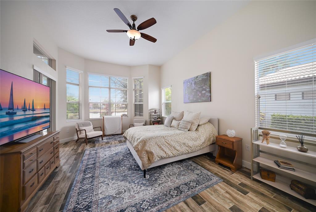 14806 Bowfin Terrace Lakewood Ranch, FL 34202 - Photo 27 of 58 a bed room with a bed and a television
