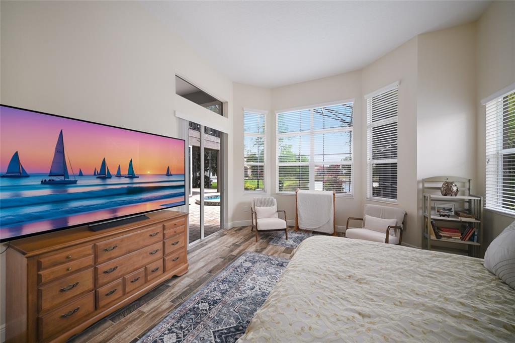 14806 Bowfin Terrace Lakewood Ranch, FL 34202 - Photo 28 of 58 a bedroom with furniture and window