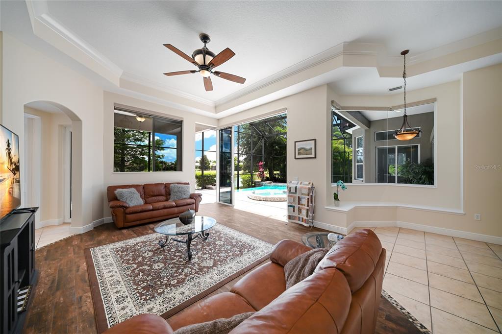 14806 Bowfin Terrace Lakewood Ranch, FL 34202 - Photo 36 of 58 a living room with furniture and a large window