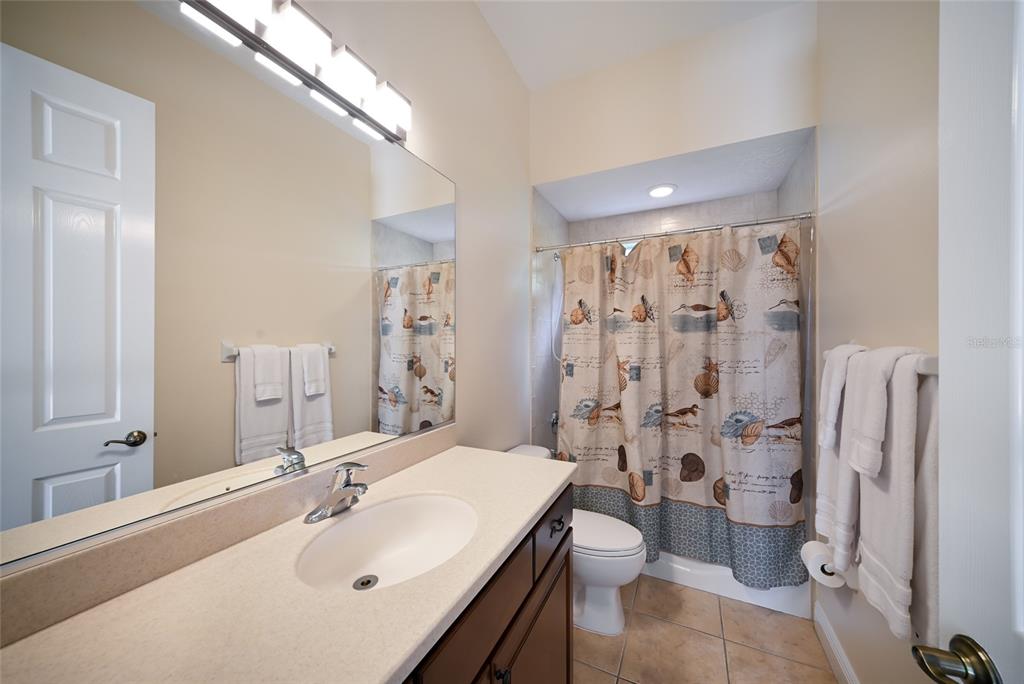 14806 Bowfin Terrace Lakewood Ranch, FL 34202 - Photo 37 of 58 a bathroom with a sink toilet and shower