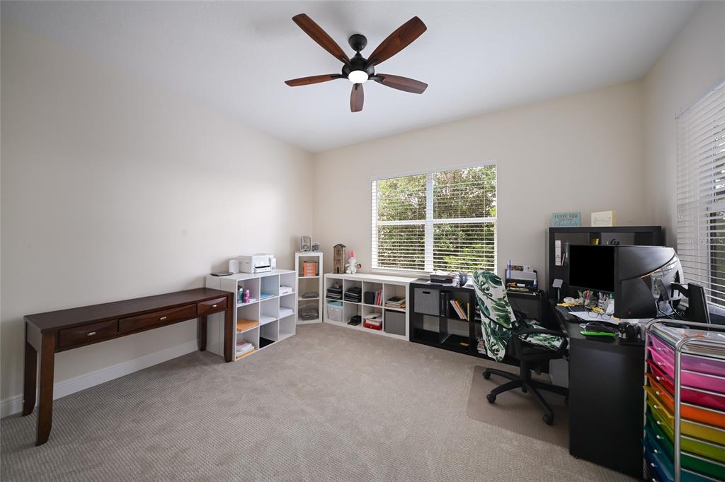 14806 Bowfin Terrace Lakewood Ranch, FL 34202 - Photo 41 of 58 a view of a workspace with furniture and a window