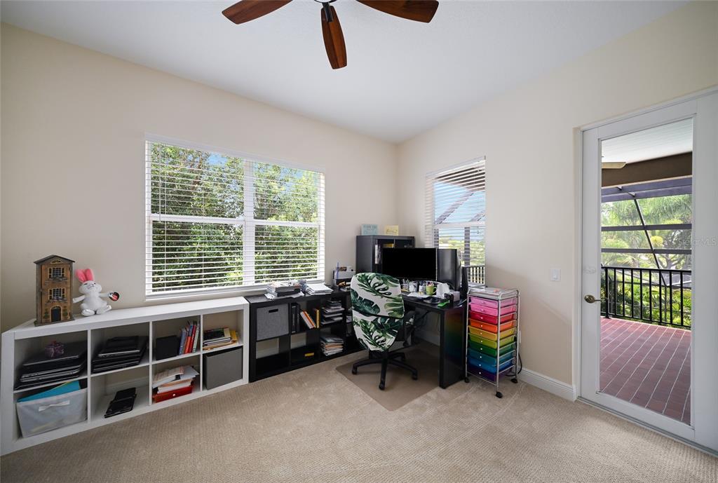 14806 Bowfin Terrace Lakewood Ranch, FL 34202 - Photo 42 of 58 a livingroom with workspace and a window