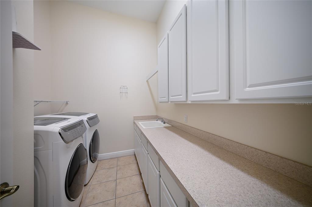14806 Bowfin Terrace Lakewood Ranch, FL 34202 - Photo 45 of 58 a utility room with dryer and washer