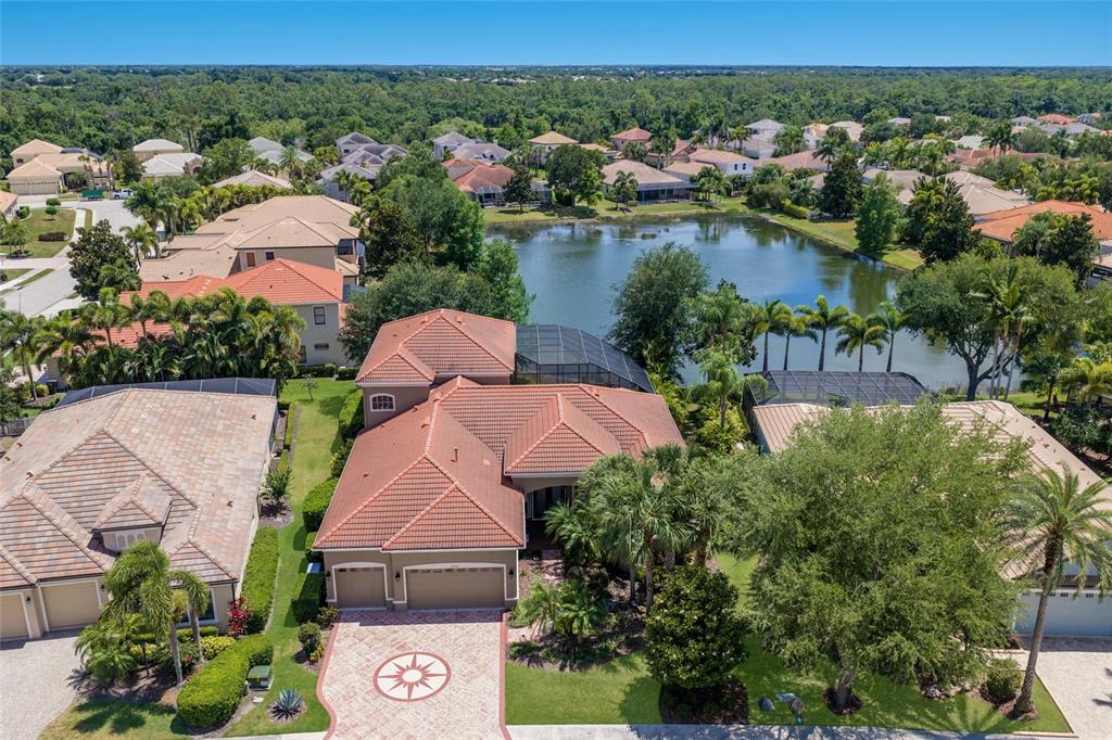 14806 Bowfin Terrace Lakewood Ranch, FL 34202 - Photo 52 of 58 an aerial view of house with yard and lake view