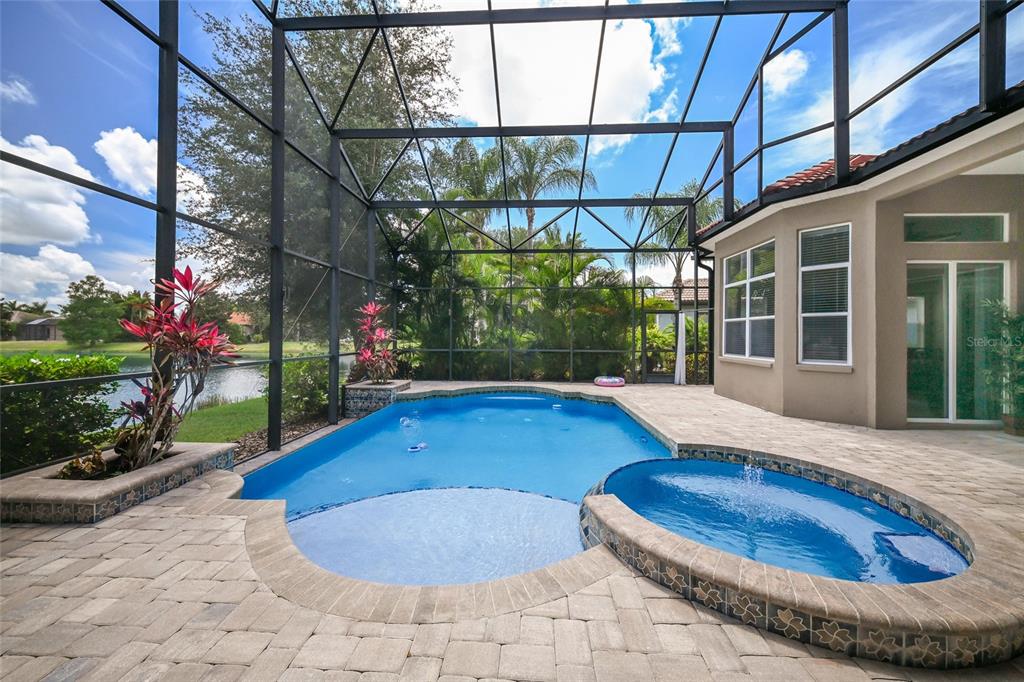 14806 Bowfin Terrace Lakewood Ranch, FL 34202 - Photo 55 of 58 a view of a backyard with plants and a patio