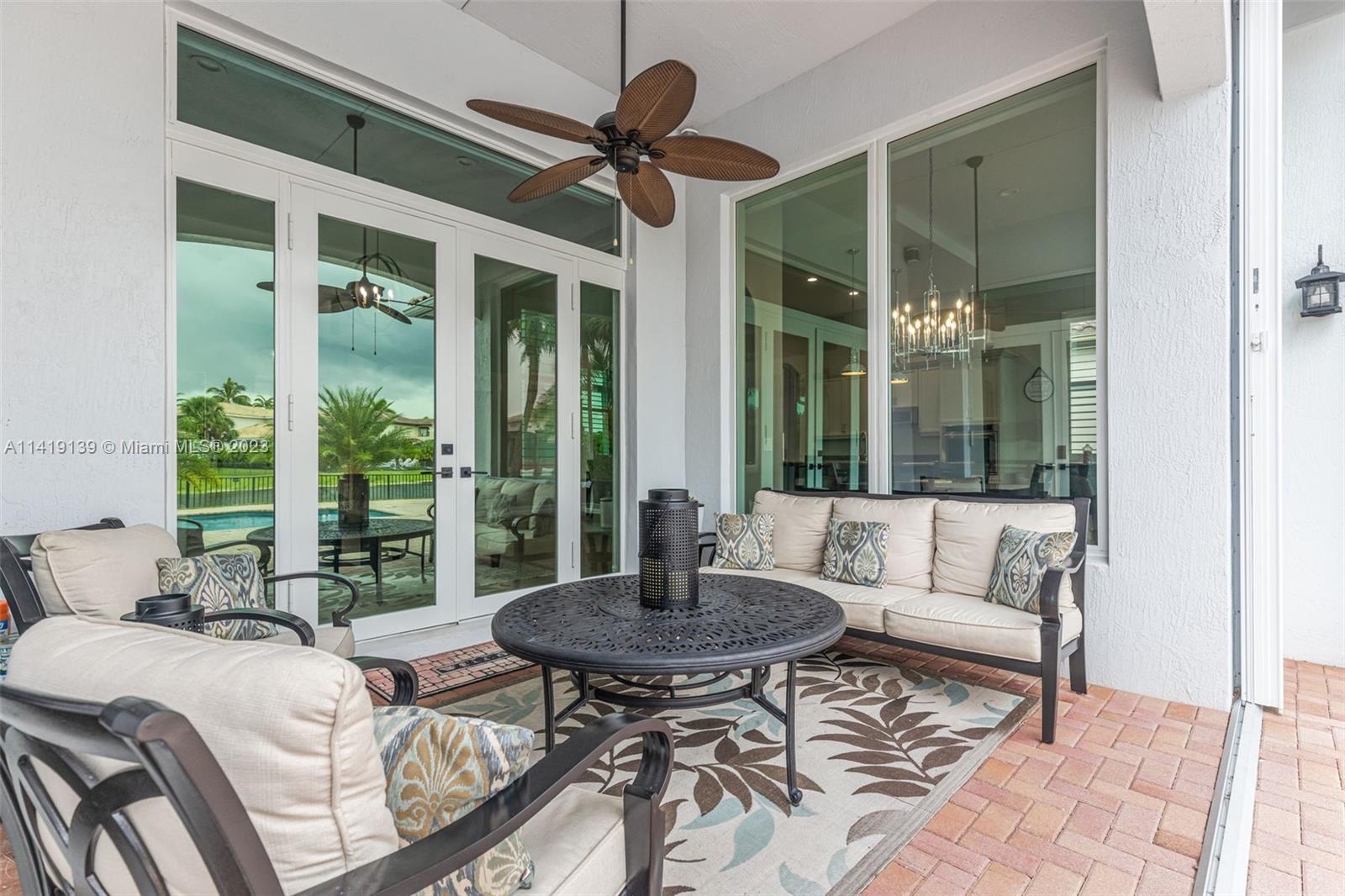 7982 Northwest 109th Lane Parkland, FL 33076 - Photo 25 of 71 a living room with furniture and a window