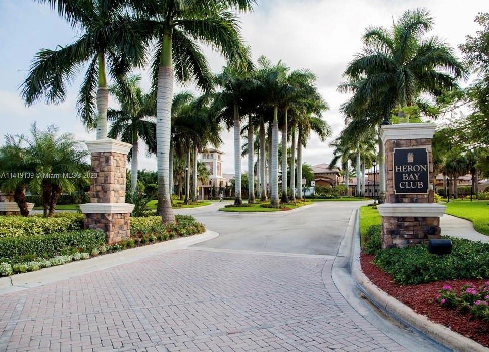 7982 Northwest 109th Lane Parkland, FL 33076 - Photo 51 of 71 a view of a yard with palm trees