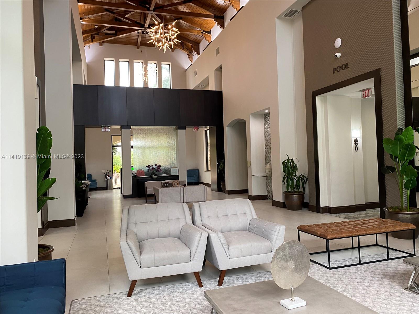 7982 Northwest 109th Lane Parkland, FL 33076 - Photo 53 of 71 a living room with furniture and a potted plant