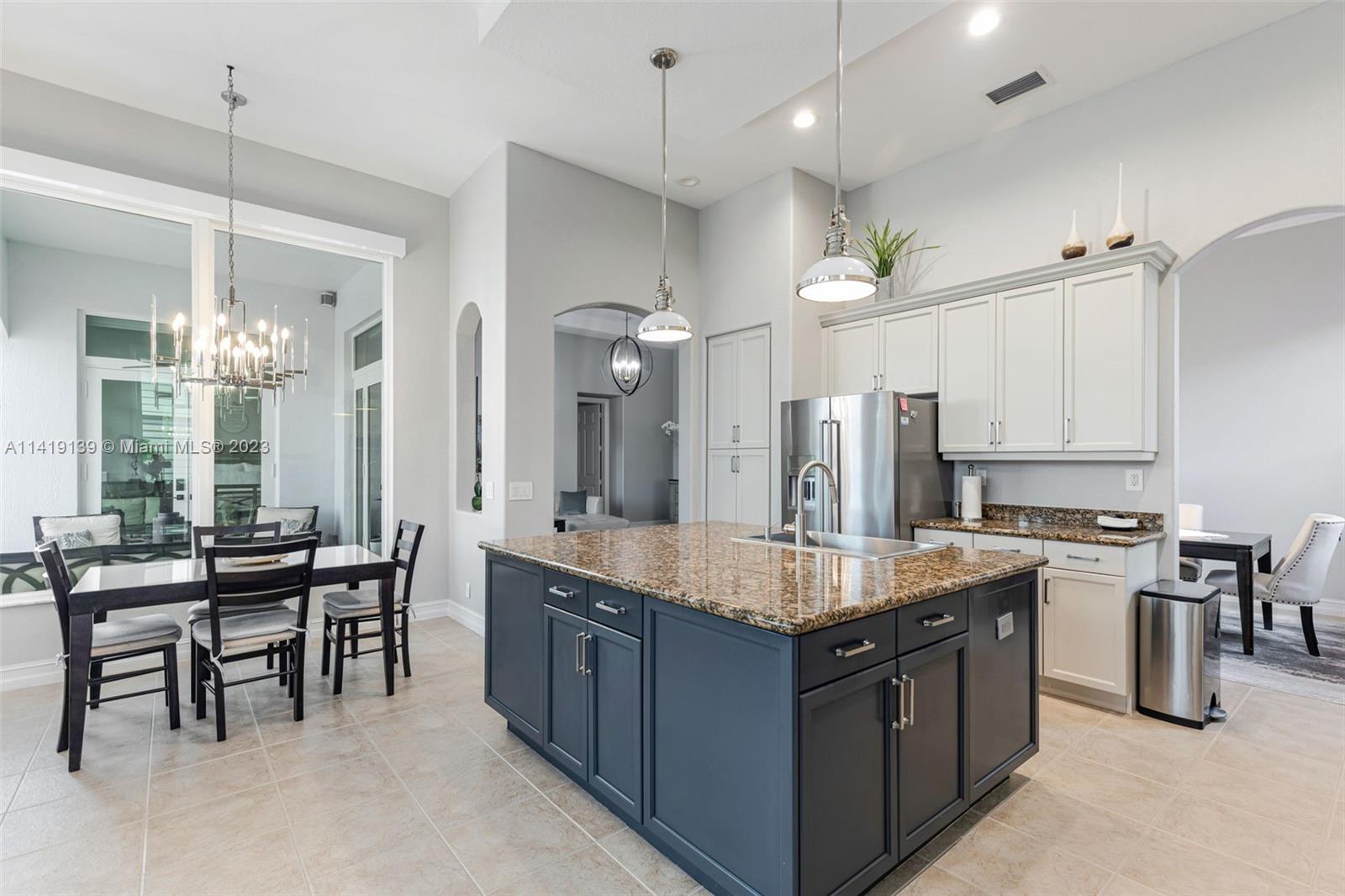 7982 Northwest 109th Lane Parkland, FL 33076 - Photo 6 of 71 a large kitchen with a large counter top appliances and cabinets