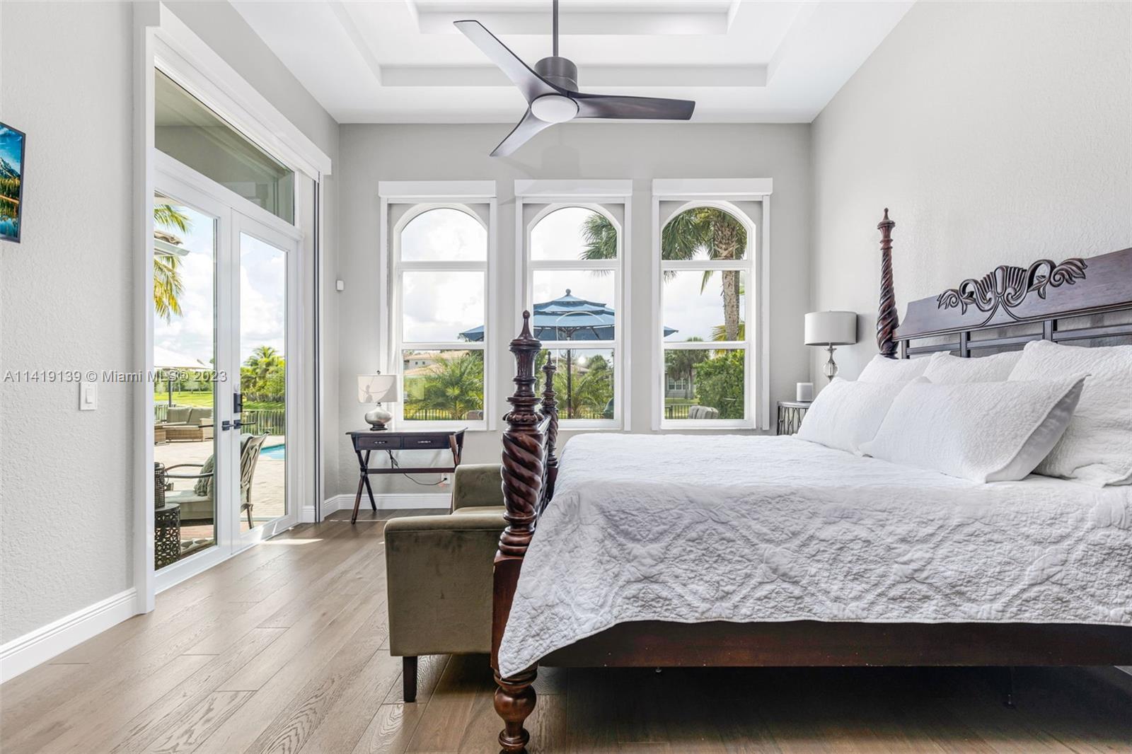 7982 Northwest 109th Lane Parkland, FL 33076 - Photo 10 of 71 a bedroom with a large bed and a large window