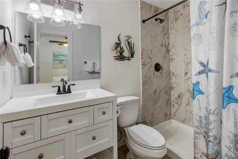a bathroom with a sink a toilet and a bathtub
