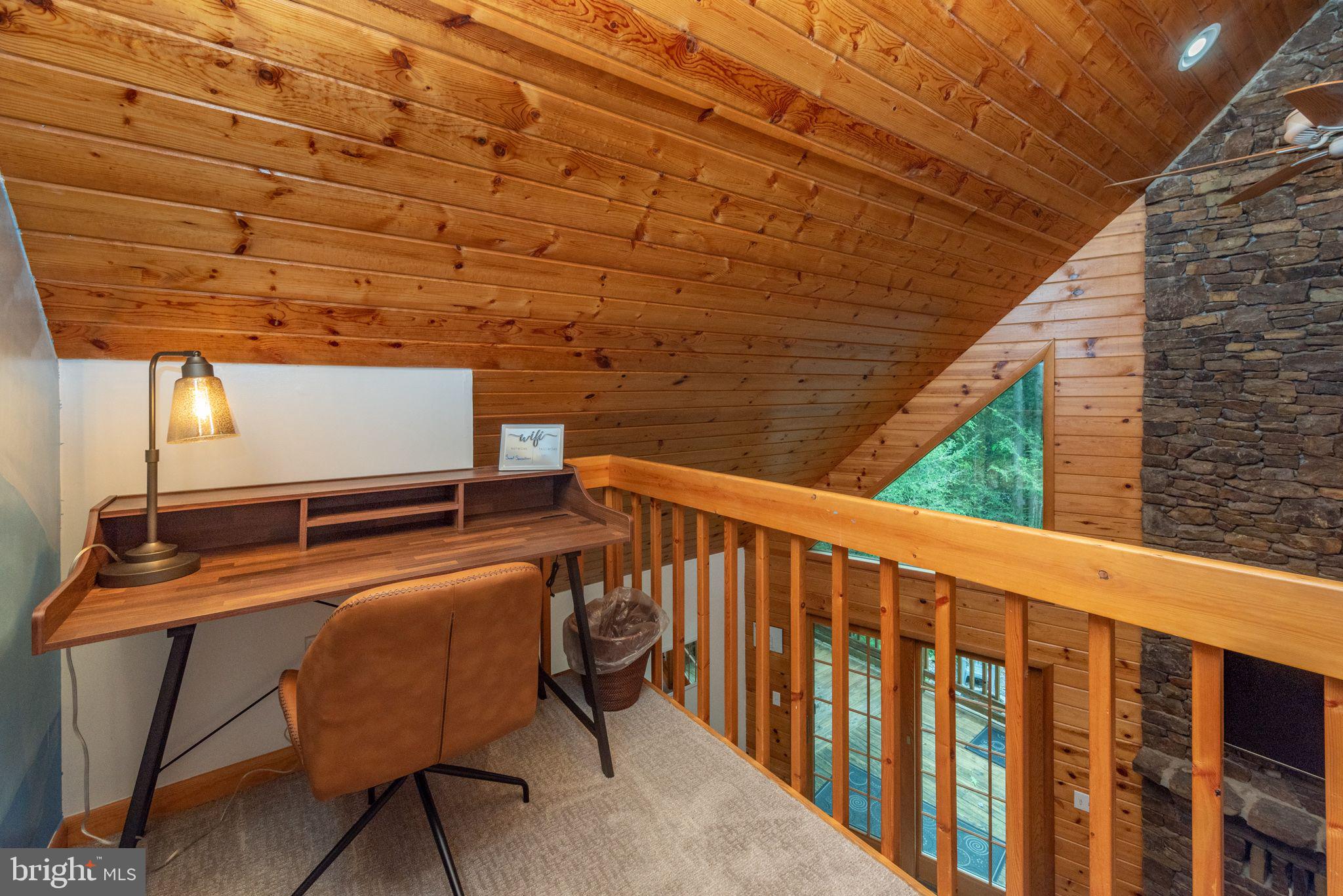 2667 Mayhew Inn Road Oakland, MD 21550 - Photo 14 of 44 a balcony with table and chairs