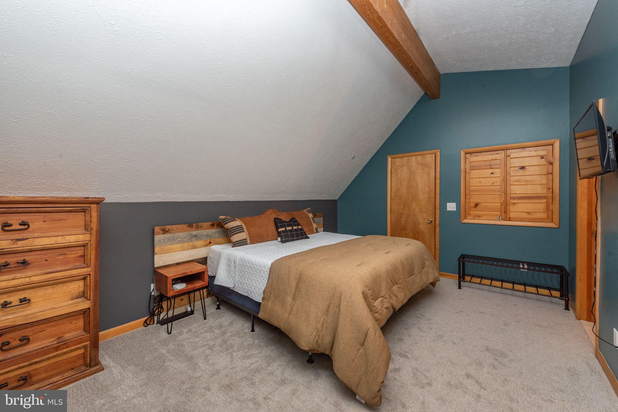 2667 Mayhew Inn Road Oakland, MD 21550 - Photo 15 of 44 a bed room with a bed chair and a window