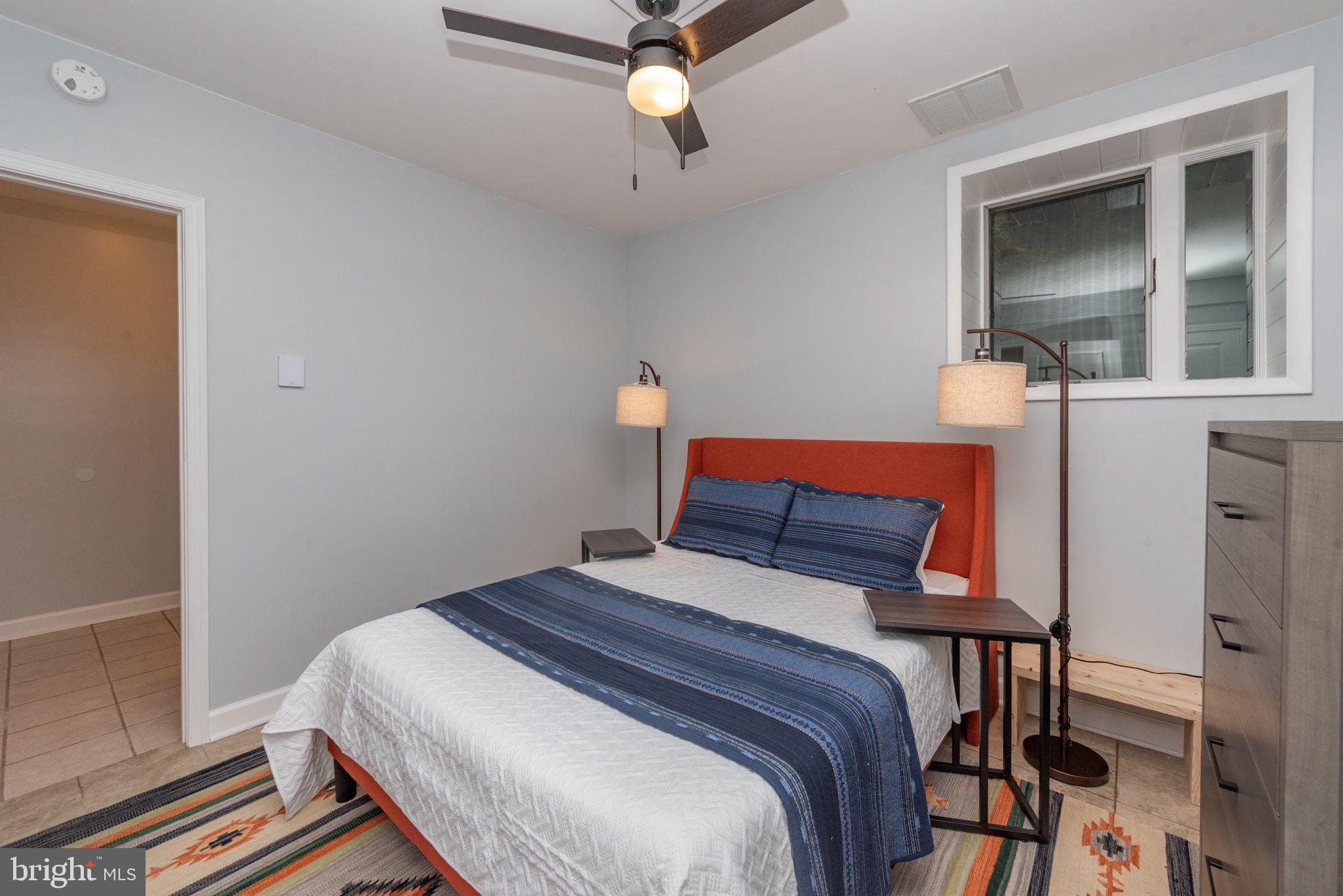 2667 Mayhew Inn Road Oakland, MD 21550 - Photo 24 of 44 a bedroom with a bed and a mirror