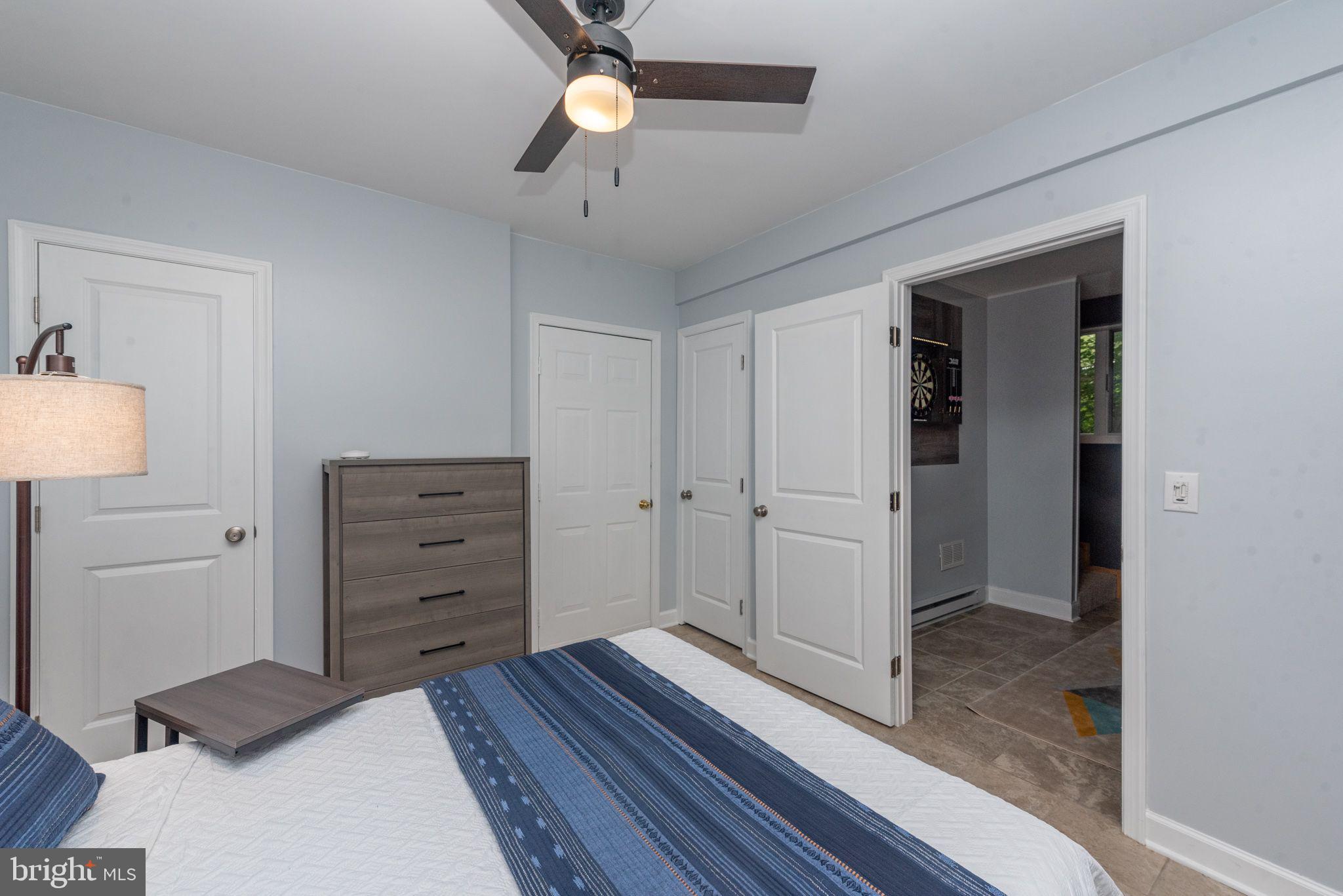 2667 Mayhew Inn Road Oakland, MD 21550 - Photo 25 of 44 a bedroom with a bed and a dresser