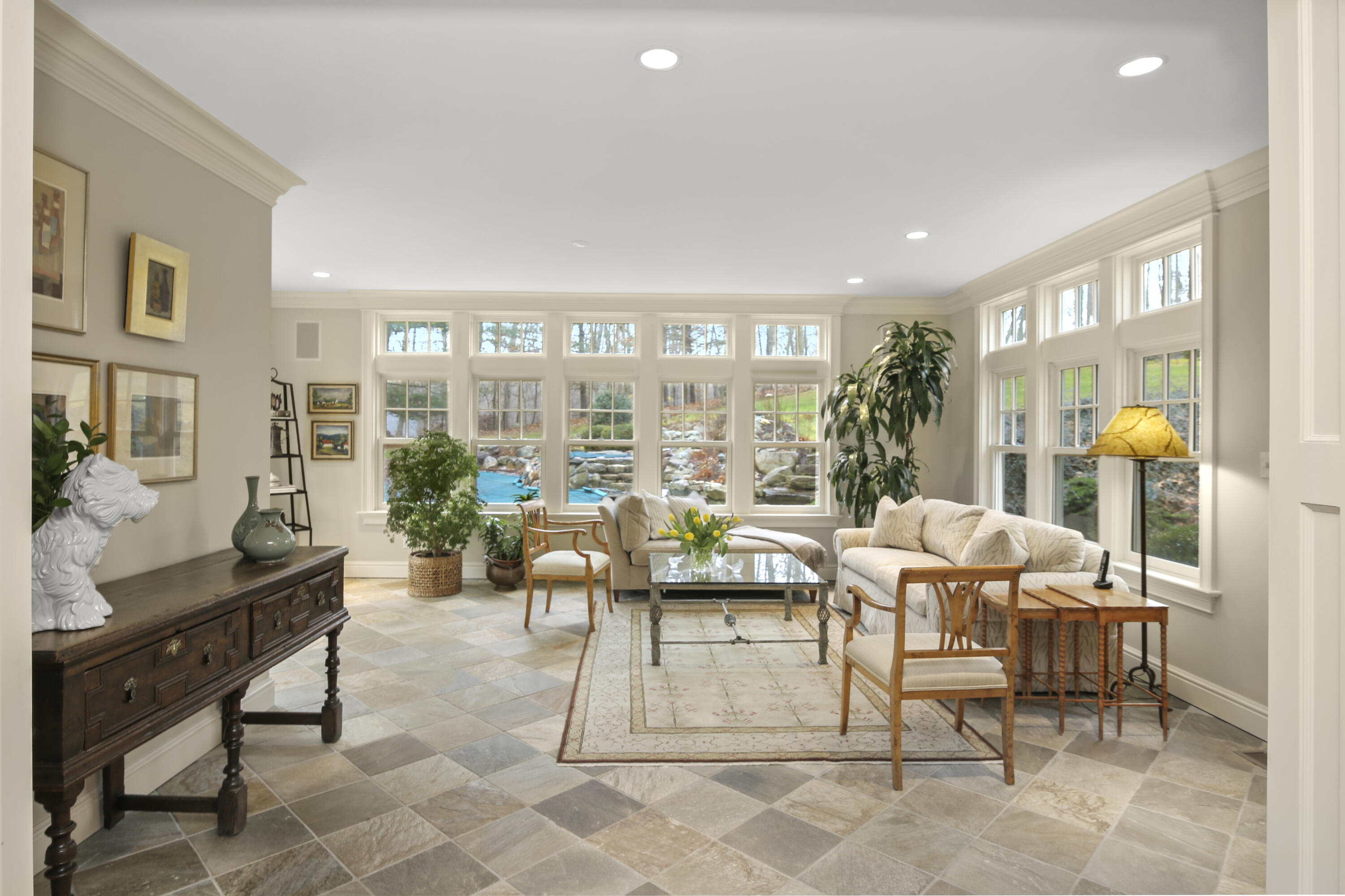 346 Frogtown Road New Canaan, CT 06840 - Photo 15 of 36 a living room with fireplace furniture and a large window