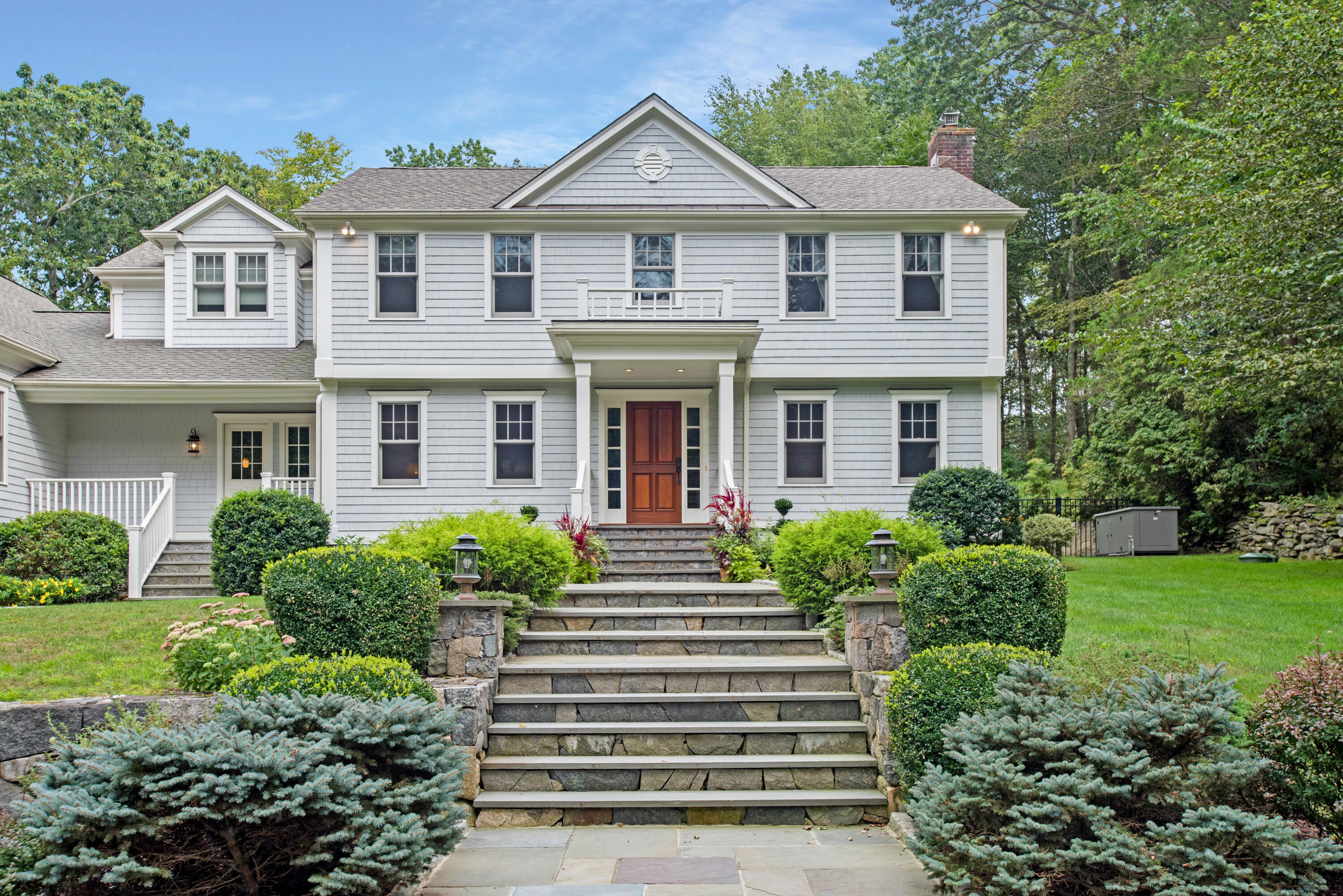 346 Frogtown Road New Canaan, CT 06840 - Photo 2 of 36 a front view of a house with a yard