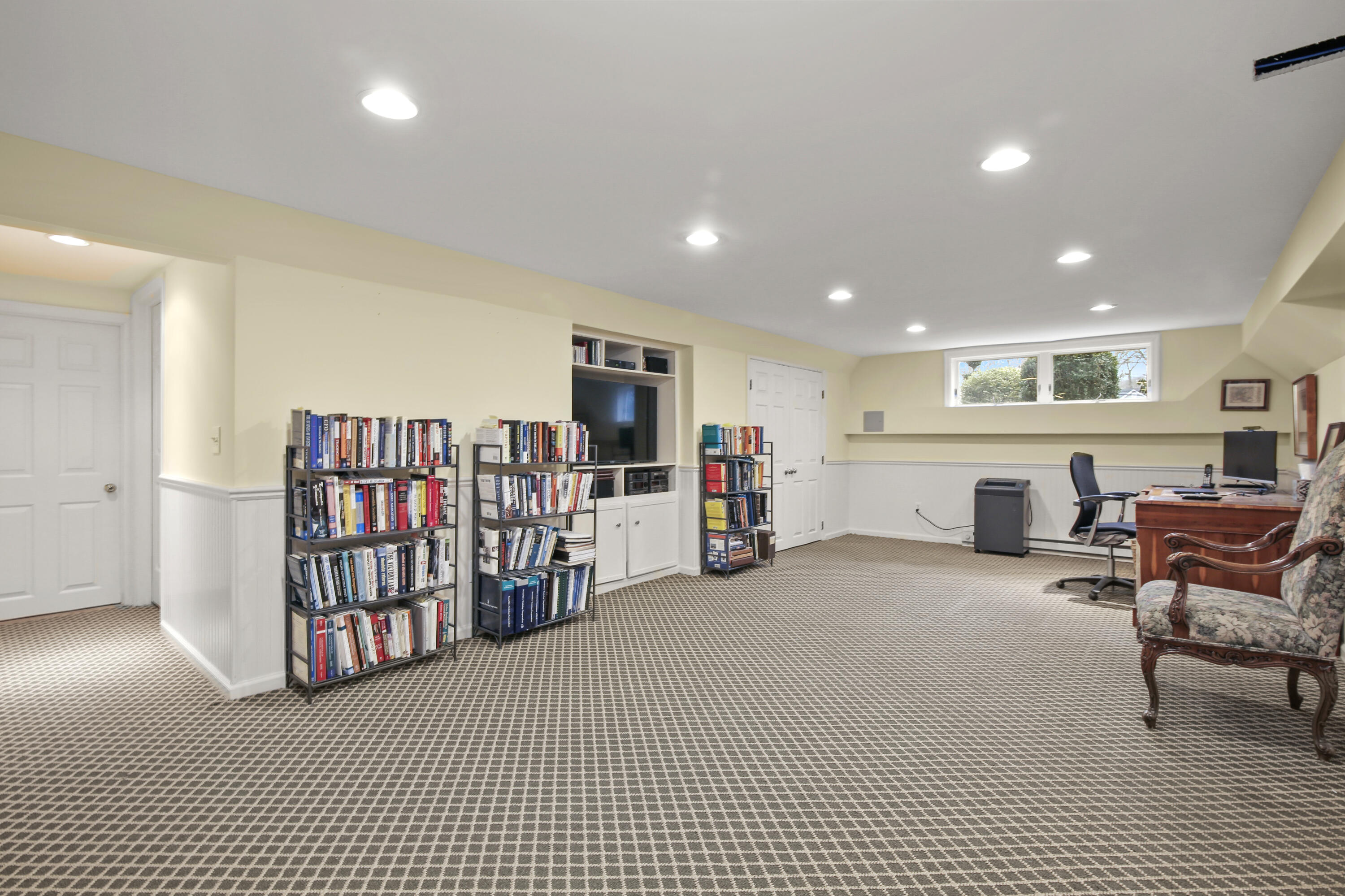 346 Frogtown Road New Canaan, CT 06840 - Photo 28 of 36 a living room with furniture and a flat screen tv