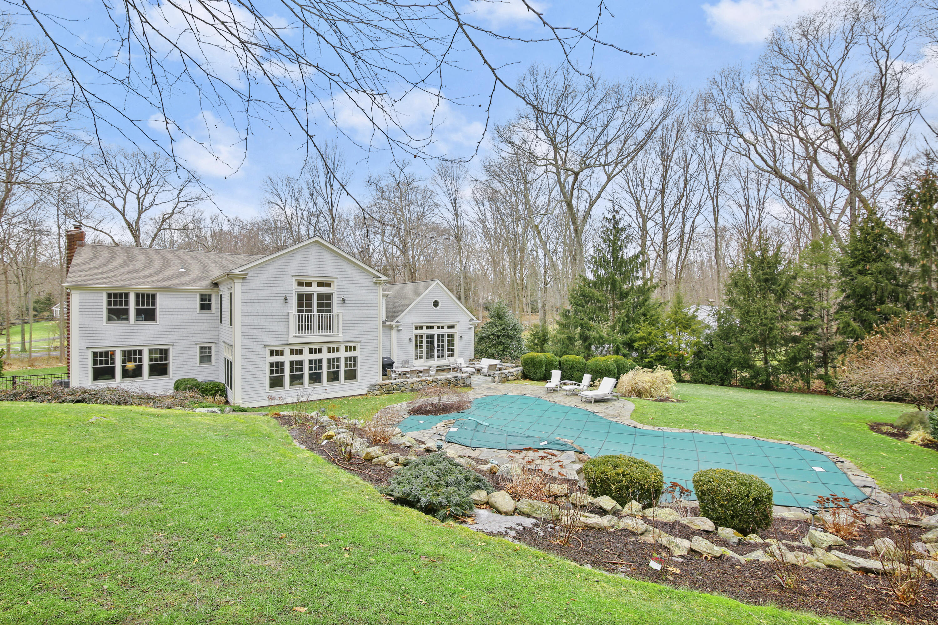 346 Frogtown Road New Canaan, CT 06840 - Photo 32 of 36 a view of house with garden and trees