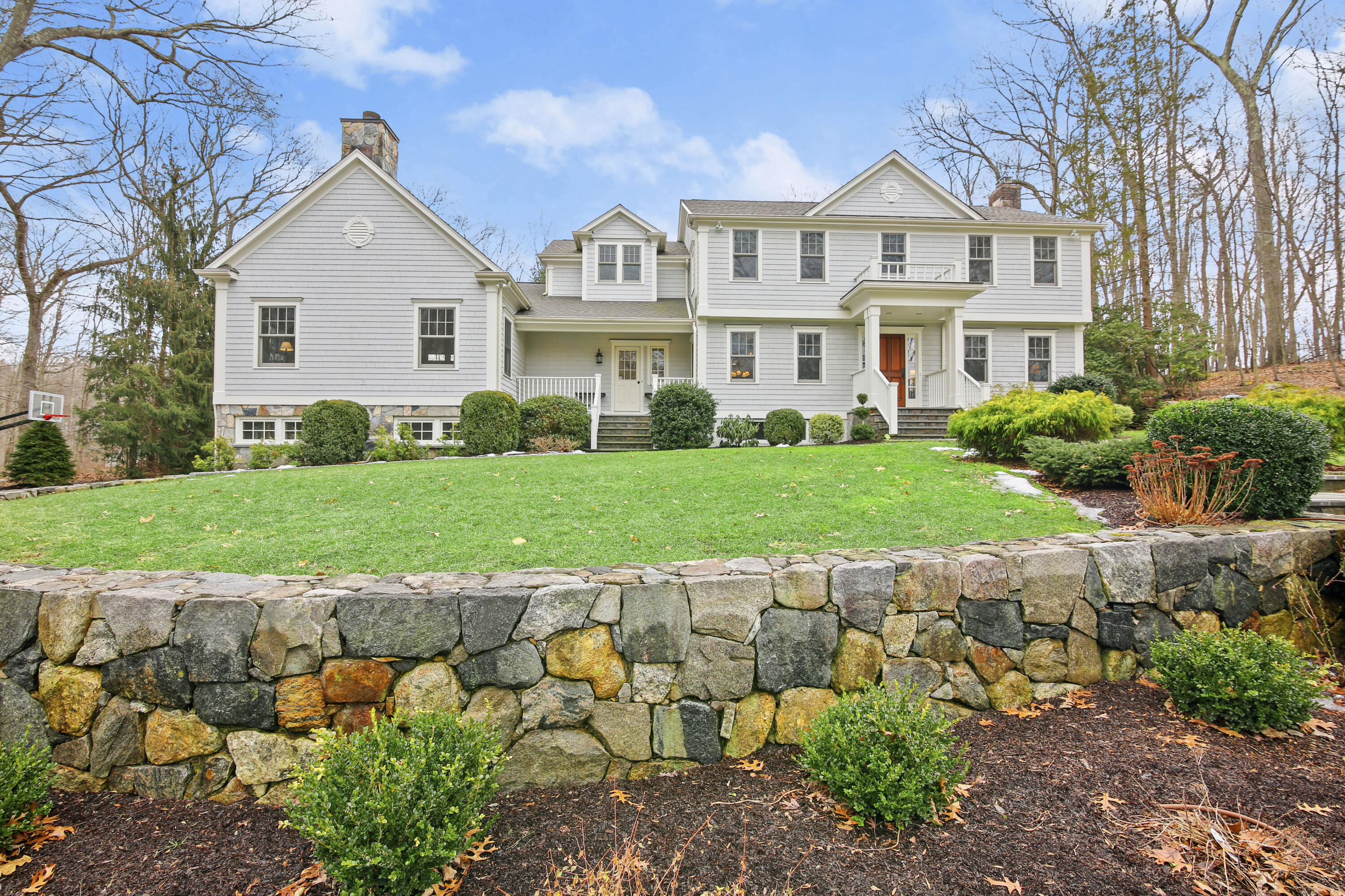 346 Frogtown Road New Canaan, CT 06840 - Photo 33 of 36 a view of a white house with a yard and potted plants
