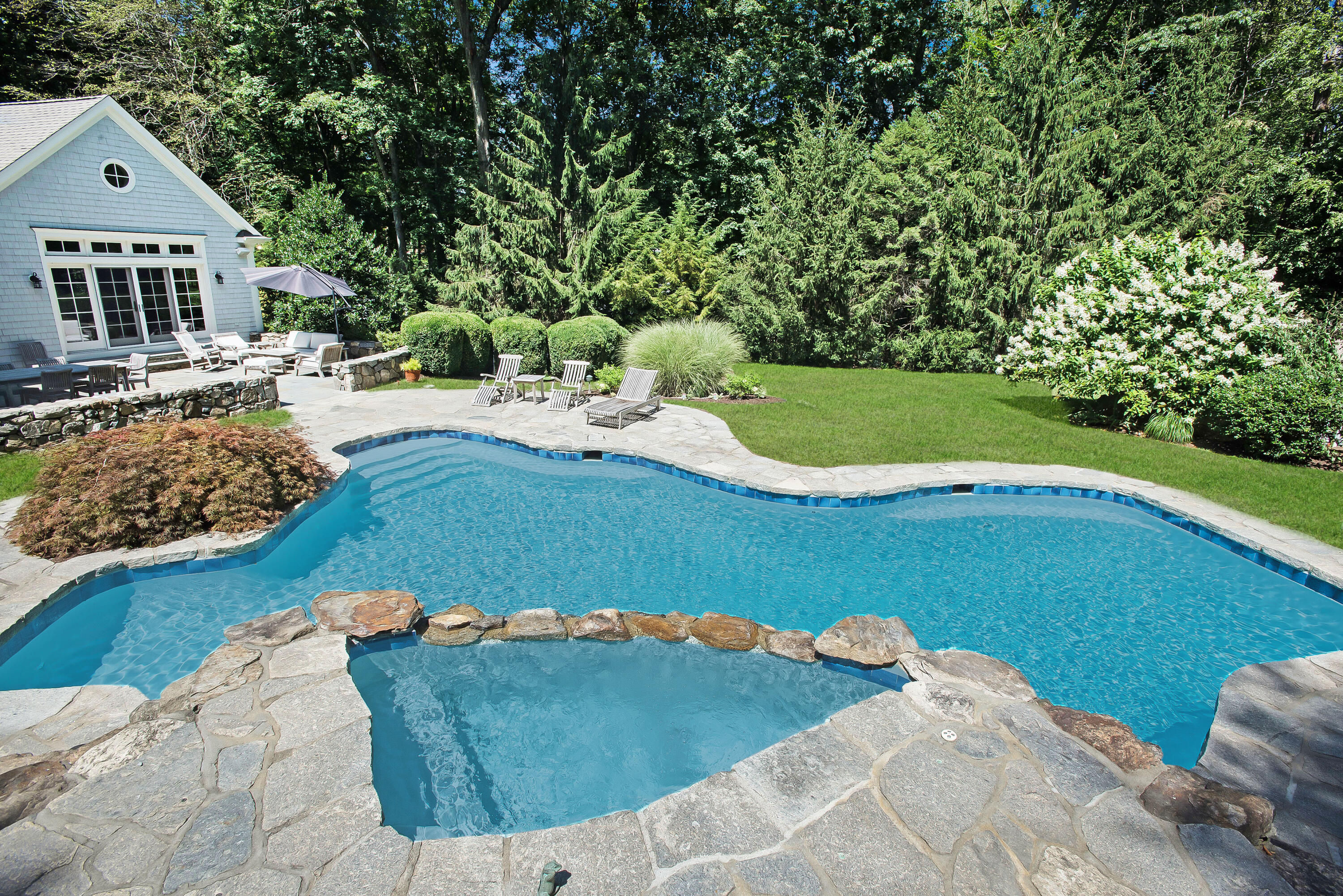 346 Frogtown Road New Canaan, CT 06840 - Photo 4 of 36 a view of a house with a yard