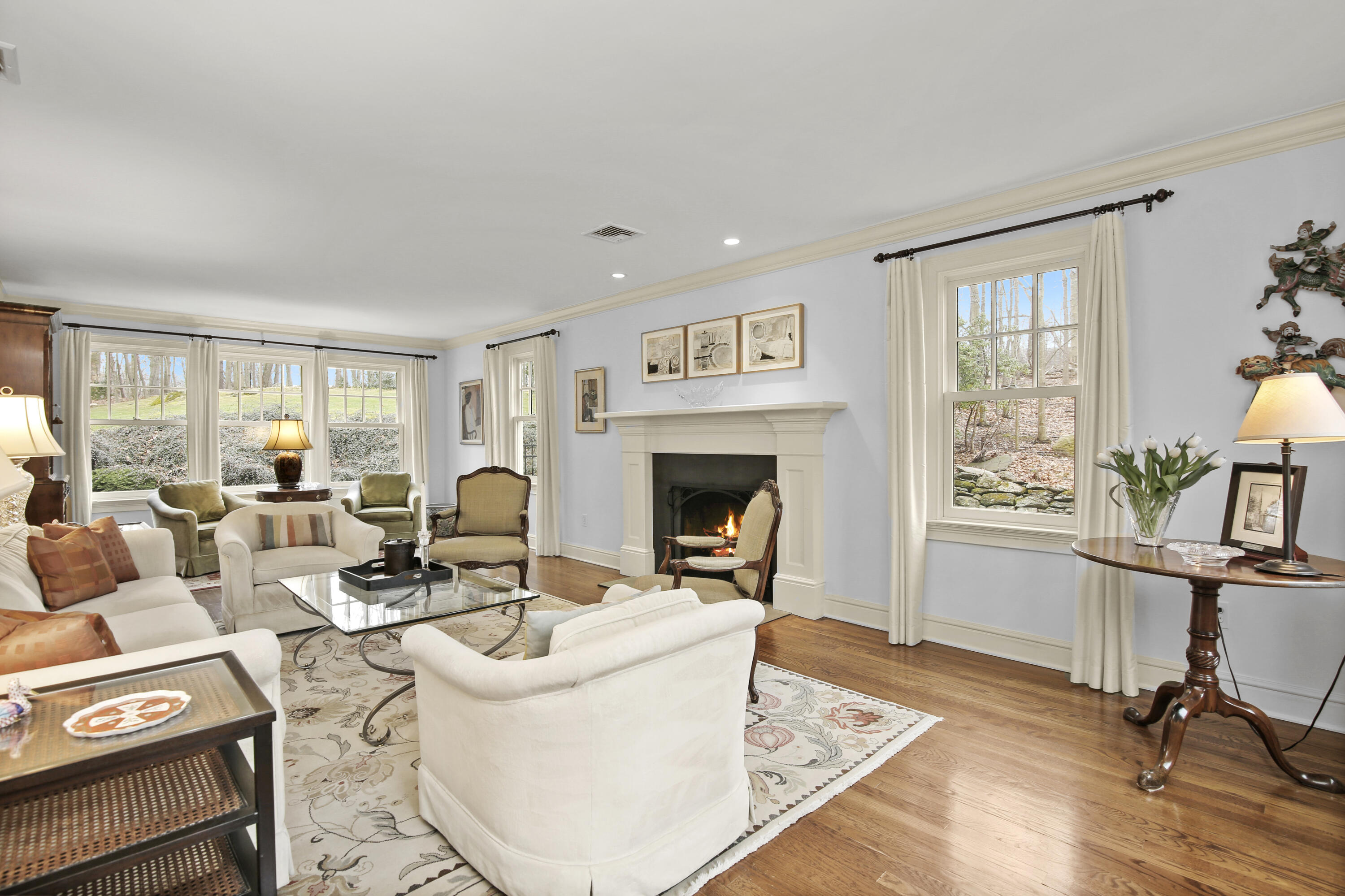 346 Frogtown Road New Canaan, CT 06840 - Photo 6 of 36 a living room with furniture a window and a fireplace