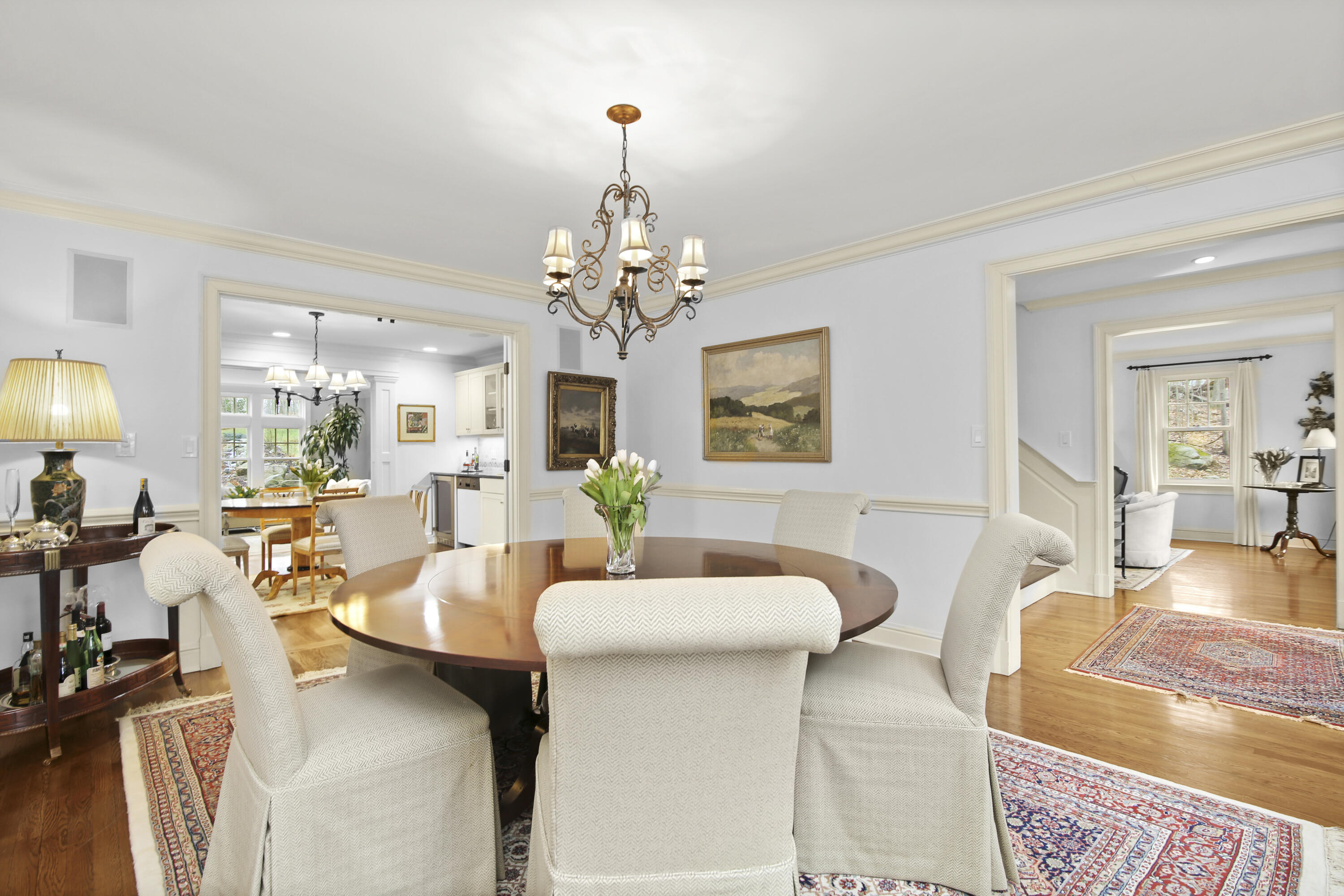 346 Frogtown Road New Canaan, CT 06840 - Photo 8 of 36 a living room with fireplace furniture and a chandelier