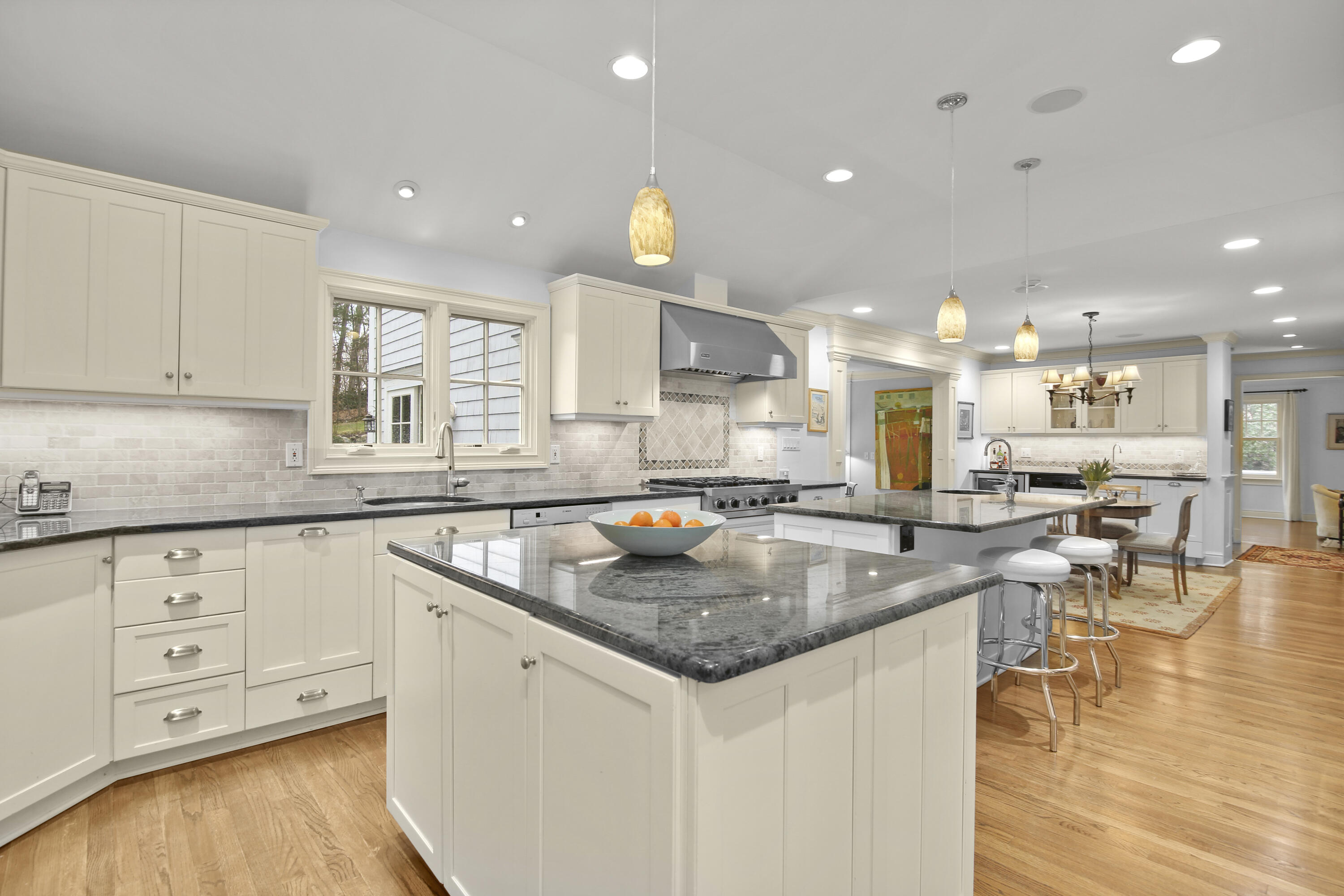 346 Frogtown Road New Canaan, CT 06840 - Photo 10 of 36 a kitchen with stainless steel appliances granite countertop a sink stove and cabinets