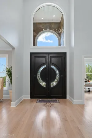 a living room with a fireplace and a wooden floor