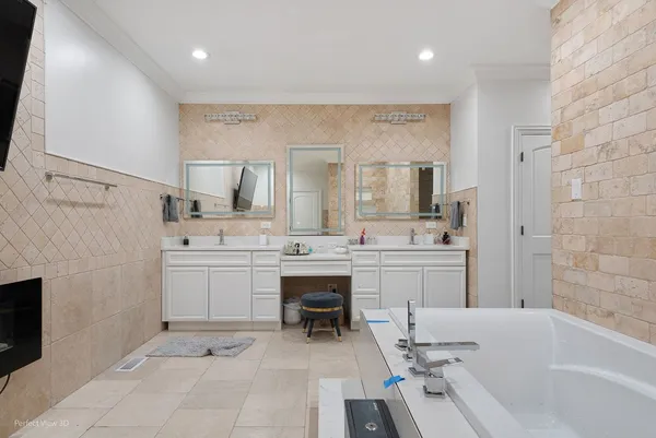 a bedroom with furniture and white walls