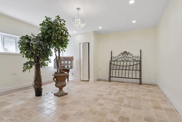 a view of entryway with flower plants