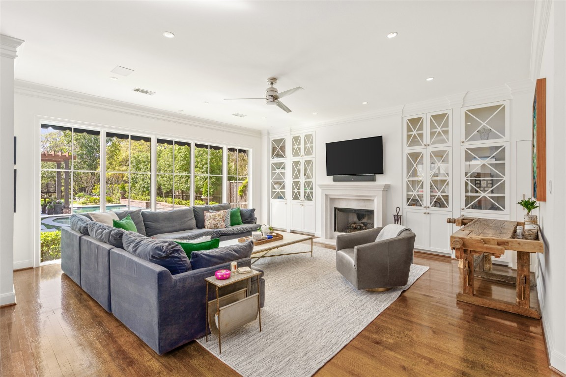 6614 Mercer Street Houston, TX 77005 - Photo 13 of 48 a living room with furniture fireplace and flat screen tv