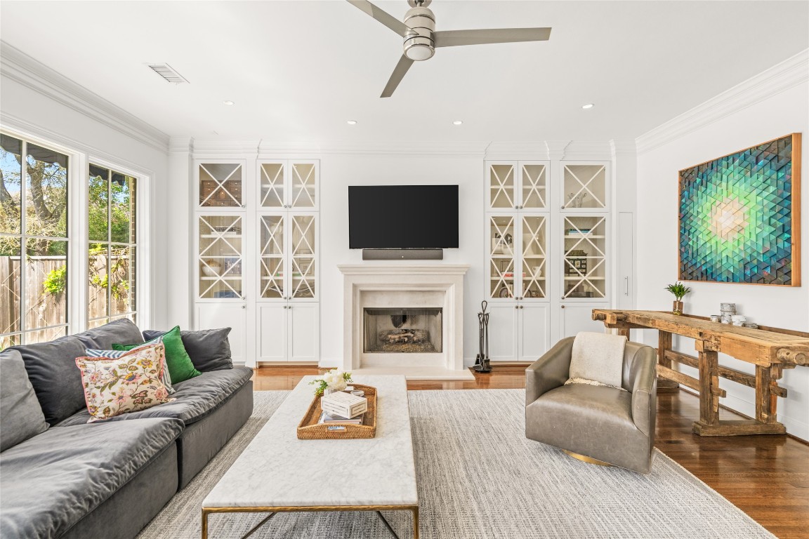 6614 Mercer Street Houston, TX 77005 - Photo 14 of 48 a living room with furniture a fireplace and a flat screen tv