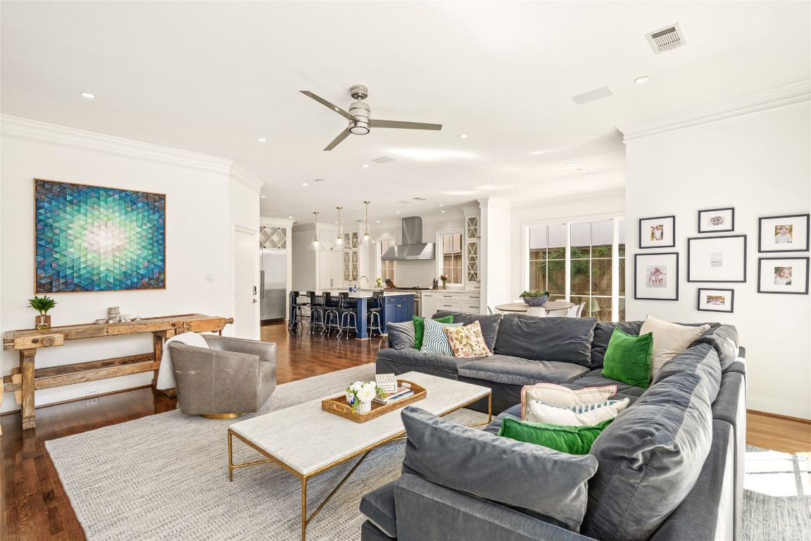 6614 Mercer Street Houston, TX 77005 - Photo 16 of 48 a living room with furniture and a flat screen tv