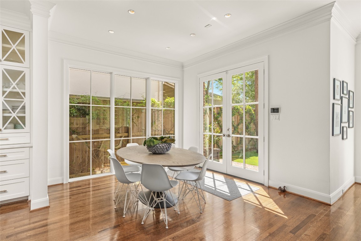 6614 Mercer Street Houston, TX 77005 - Photo 18 of 48 a view of a dining room with furniture and wooden floor
