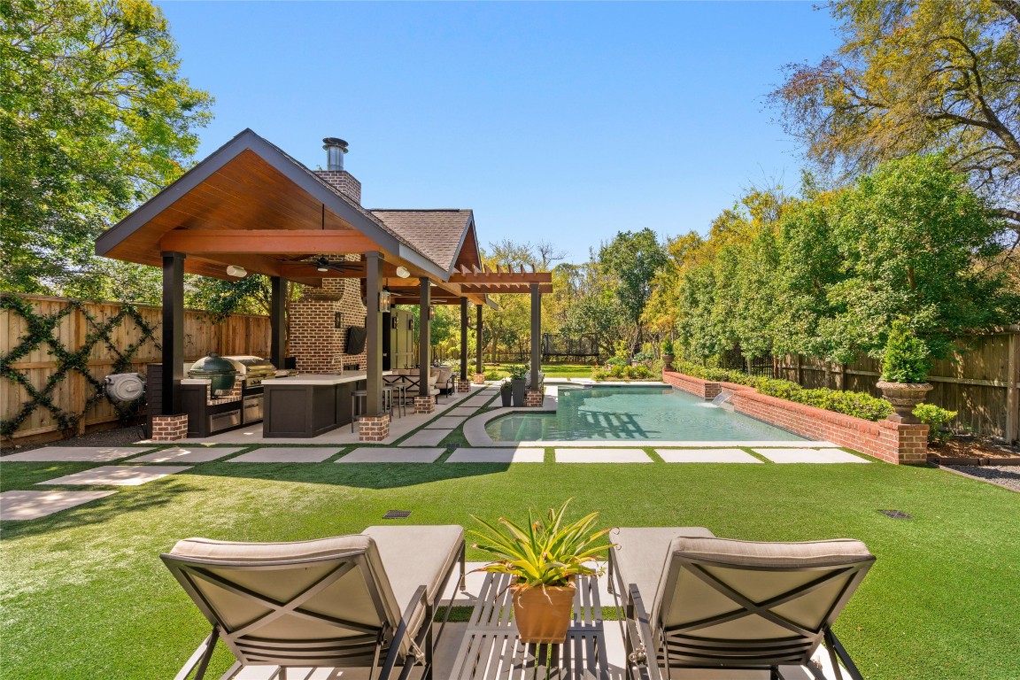 6614 Mercer Street Houston, TX 77005 - Photo 2 of 48 a view of a house with swimming pool and sitting area
