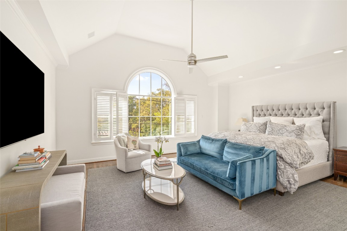 6614 Mercer Street Houston, TX 77005 - Photo 20 of 48 a spacious bedroom with a bed and a flat screen tv
