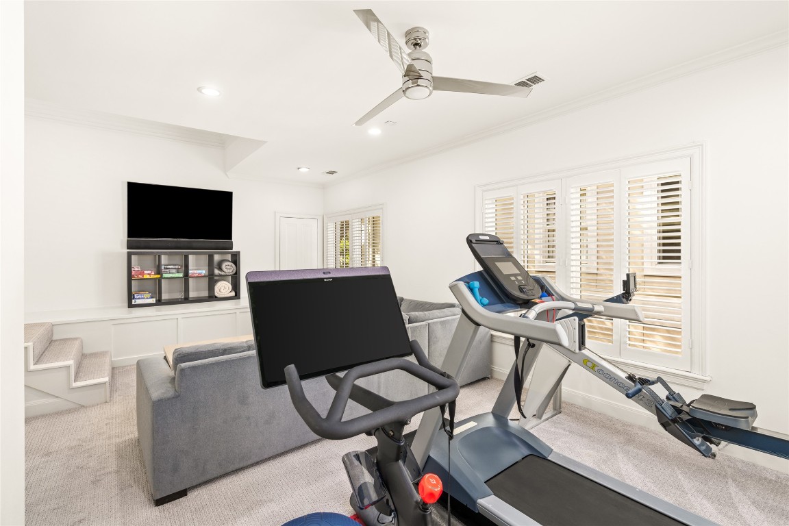 6614 Mercer Street Houston, TX 77005 - Photo 25 of 48 a living room with furniture a flat screen tv and a large window