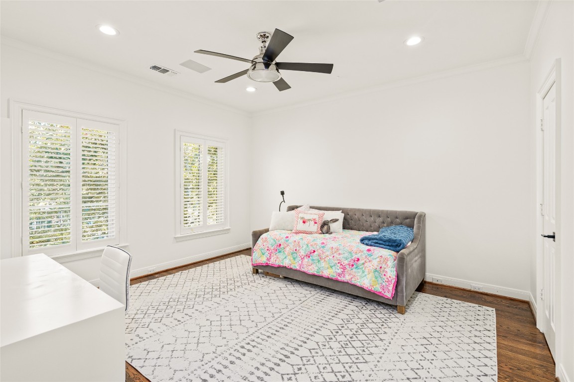 6614 Mercer Street Houston, TX 77005 - Photo 29 of 48 a bedroom with a bed and a window