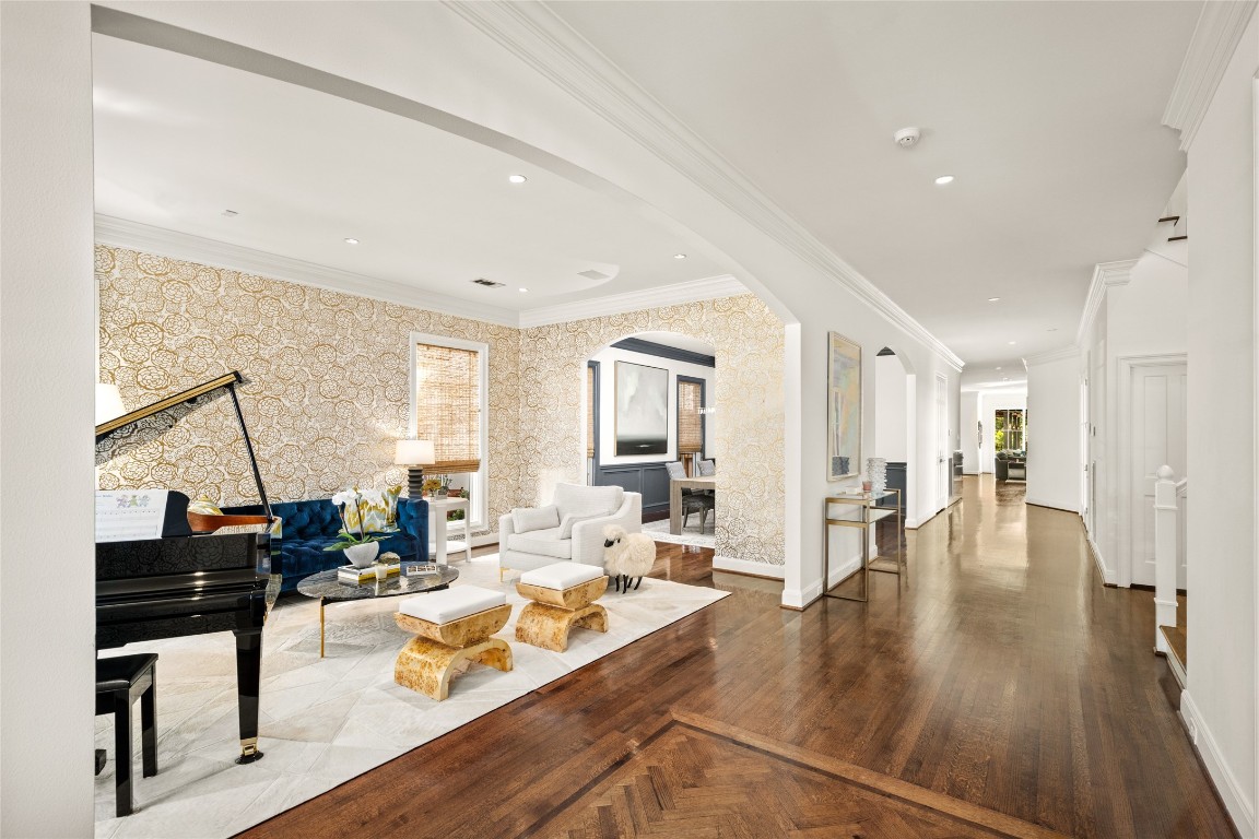 6614 Mercer Street Houston, TX 77005 - Photo 3 of 48 a living room with fireplace furniture and a wooden floor
