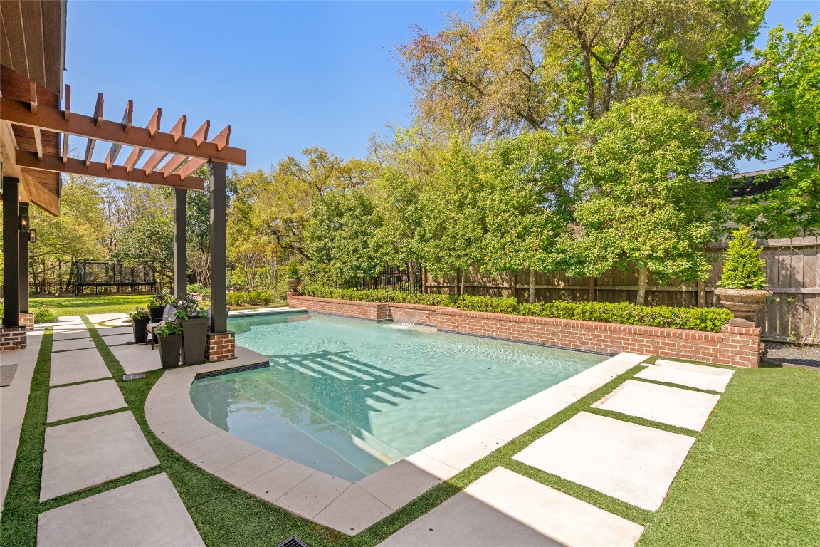 6614 Mercer Street Houston, TX 77005 - Photo 35 of 48 a view of a swimming pool with a patio