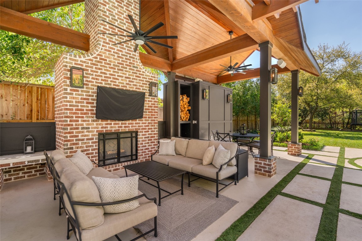 6614 Mercer Street Houston, TX 77005 - Photo 37 of 48 a outdoor living space with patio furniture and a fireplace