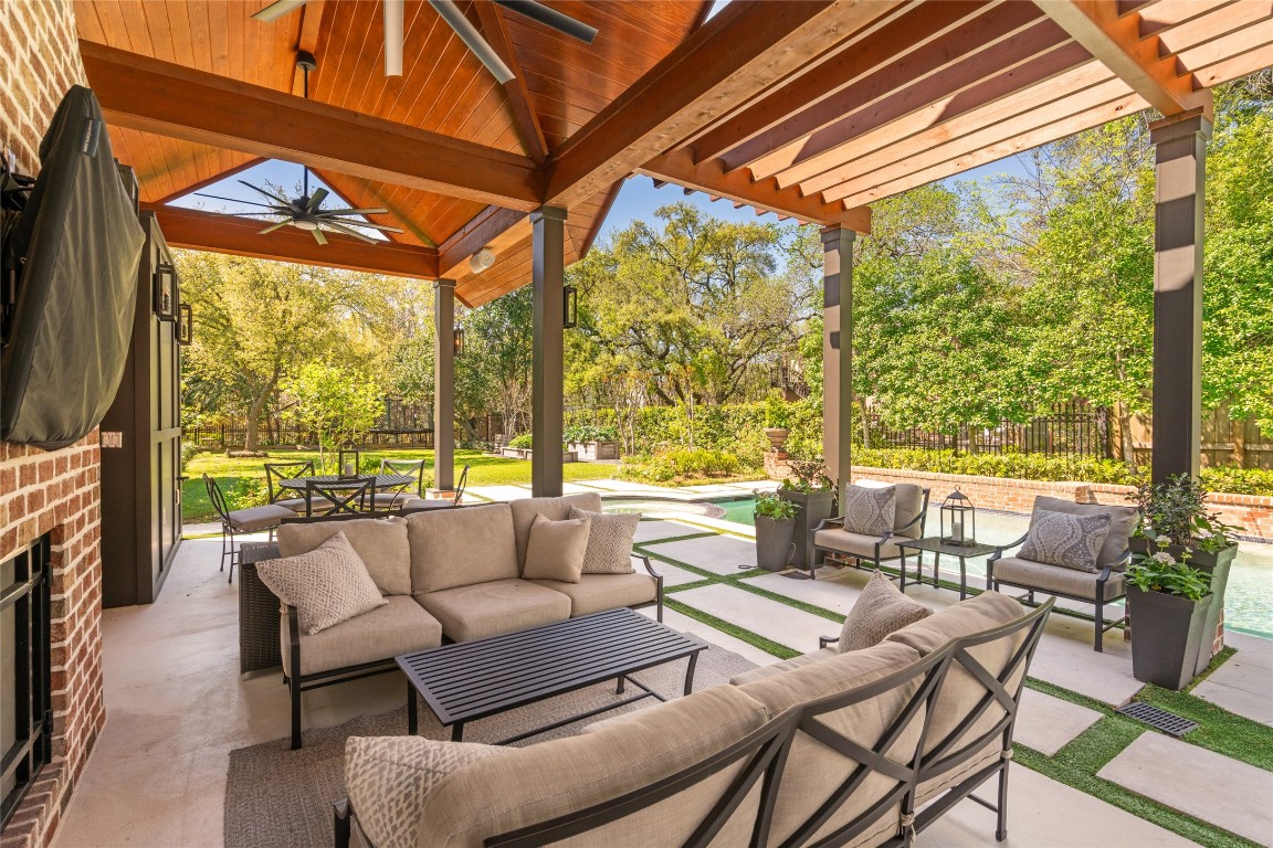6614 Mercer Street Houston, TX 77005 - Photo 41 of 48 a roof deck with couches under an umbrella