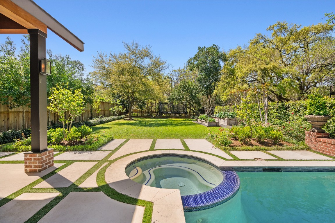 6614 Mercer Street Houston, TX 77005 - Photo 43 of 48 a swimming pool with outdoor seating and yard