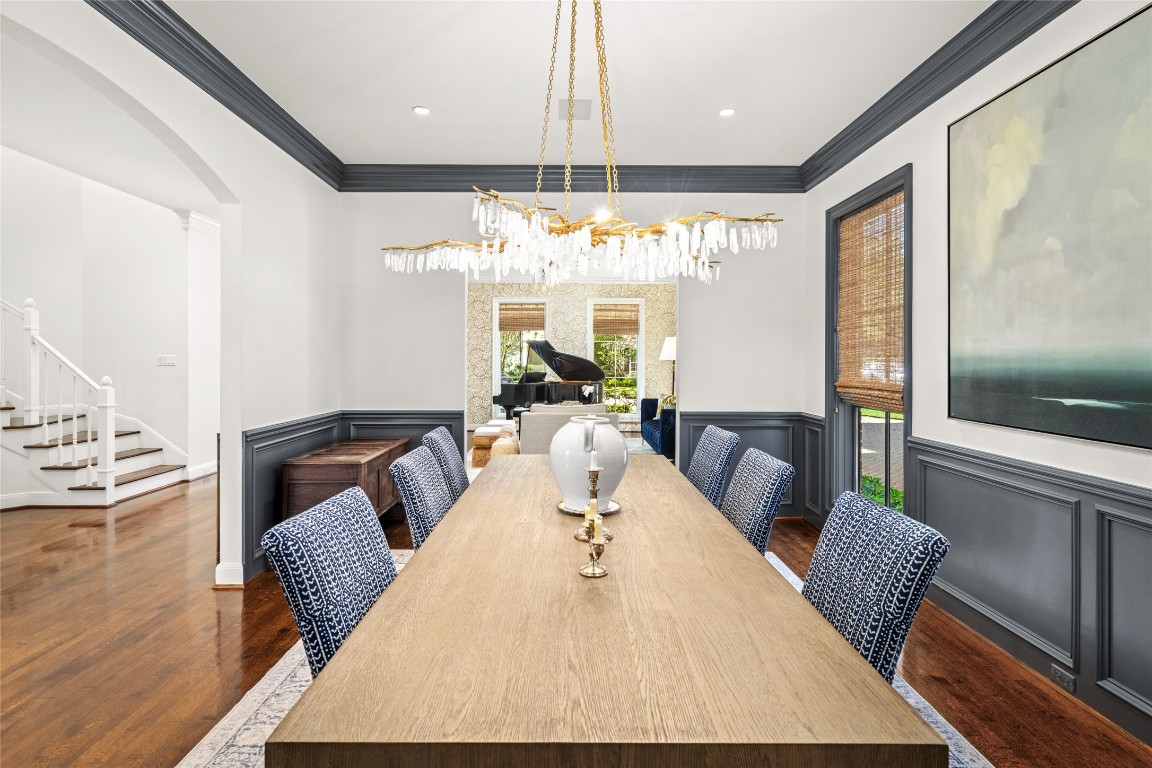 6614 Mercer Street Houston, TX 77005 - Photo 7 of 48 a dining room with furniture a large window and wooden floor