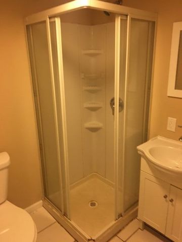5707 Fox Lake Road McHenry, IL 60051 - Photo 14 of 14 a bathroom with a sink and a shower