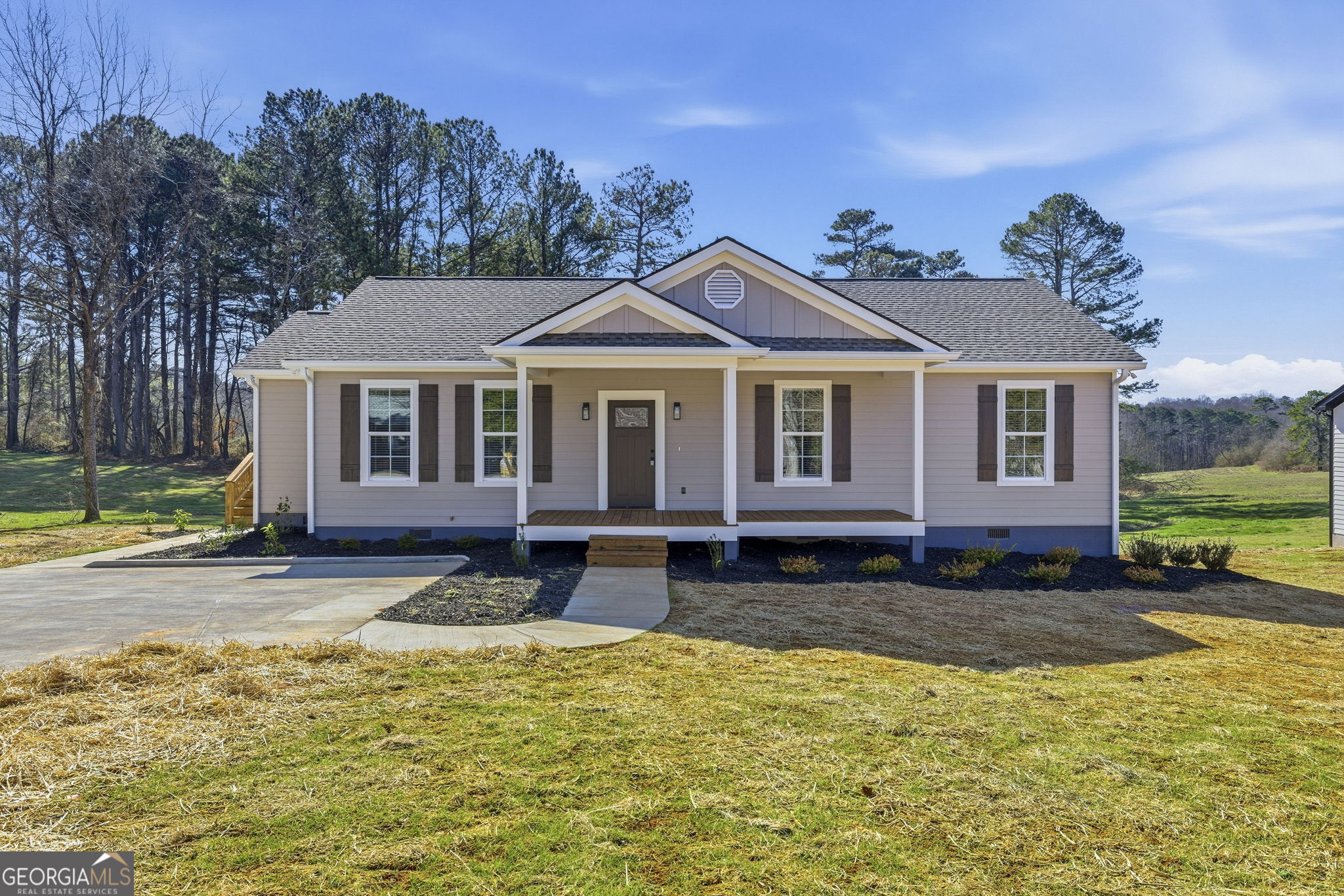 238 Carl Loudermilk Road Mount Airy, GA 30563 - Photo 1 of 28 a view of a yard with a house in the background