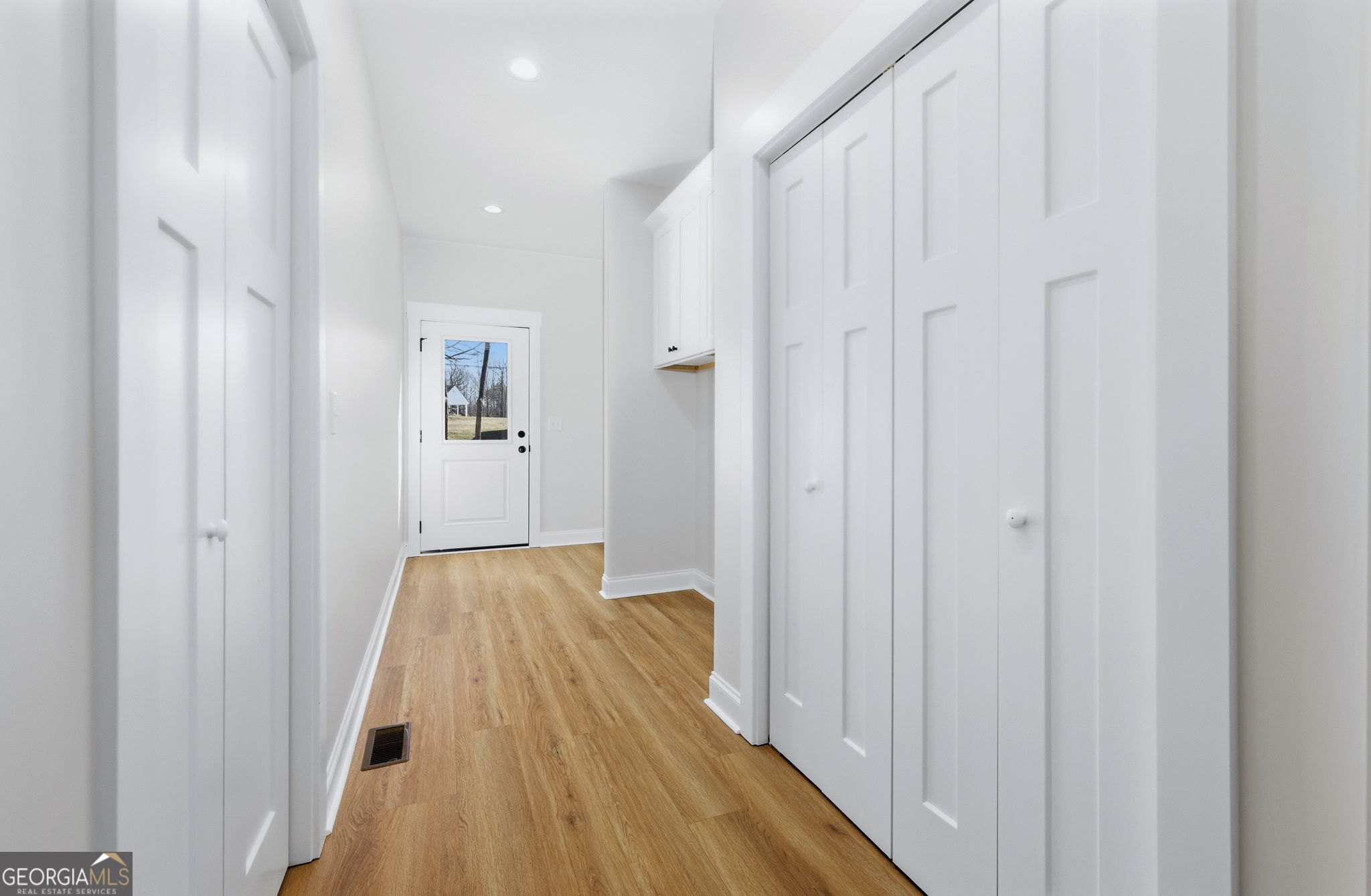 238 Carl Loudermilk Road Mount Airy, GA 30563 - Photo 11 of 28 a view of a bedroom with bed and hallway